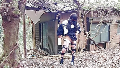 Transgender asian pissing in an abandoned house outdoors