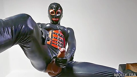 Sexy girl is getting a fetish on the bed in front of a big dildo